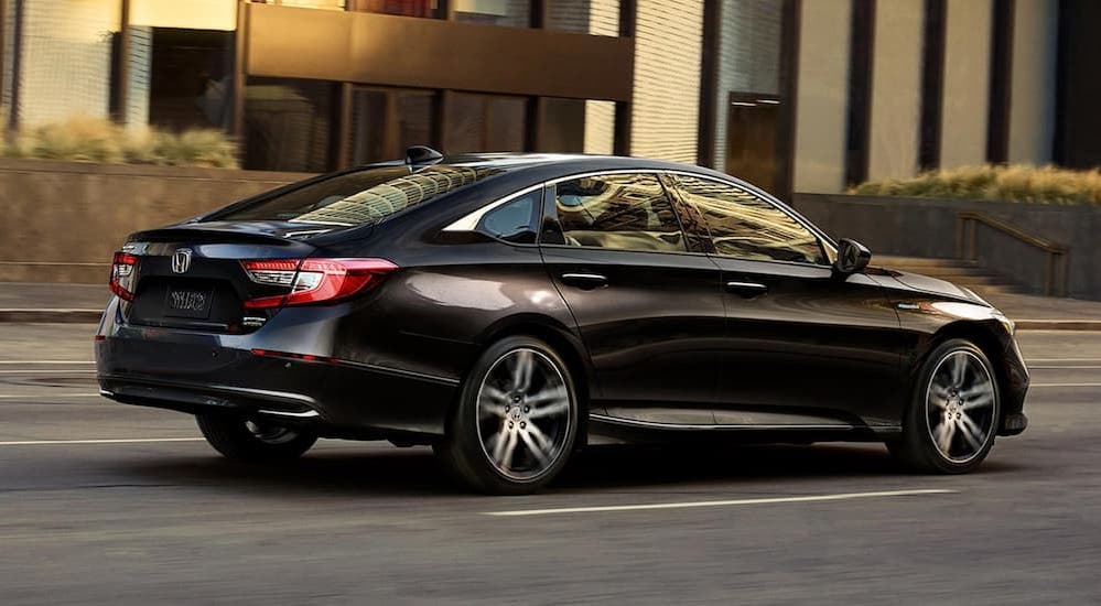 A black 2022 Honda Accord is shown during a test drive at a used car dealer near Shelbyville.