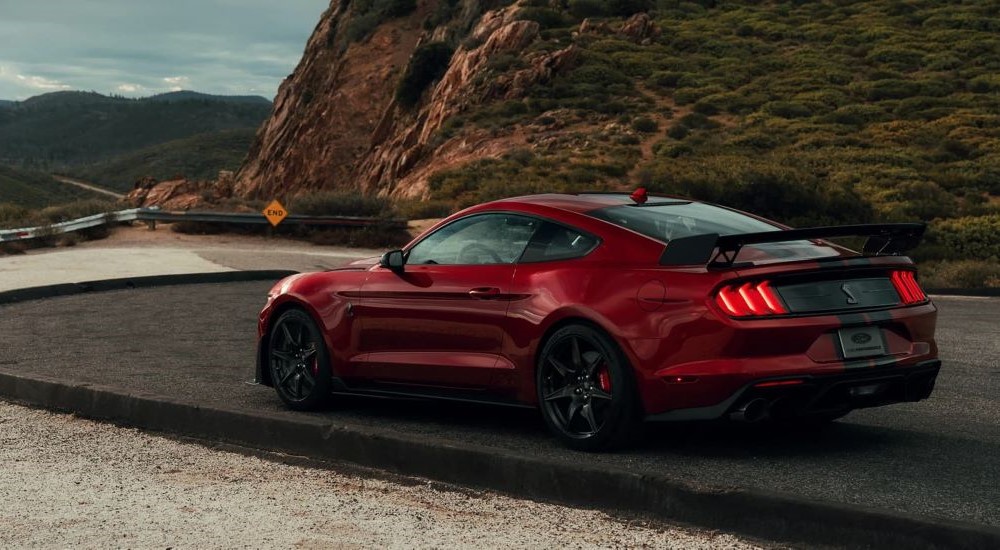A red 2022 Ford Mustang GT500 parked at a mountain overlook.